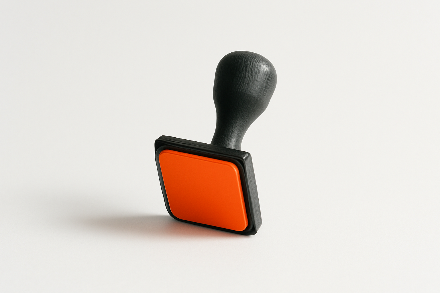 Charcoal grey stamp with Robot Orange face hovering unpressed above white paper, symbolizing ai alignment failures from missi