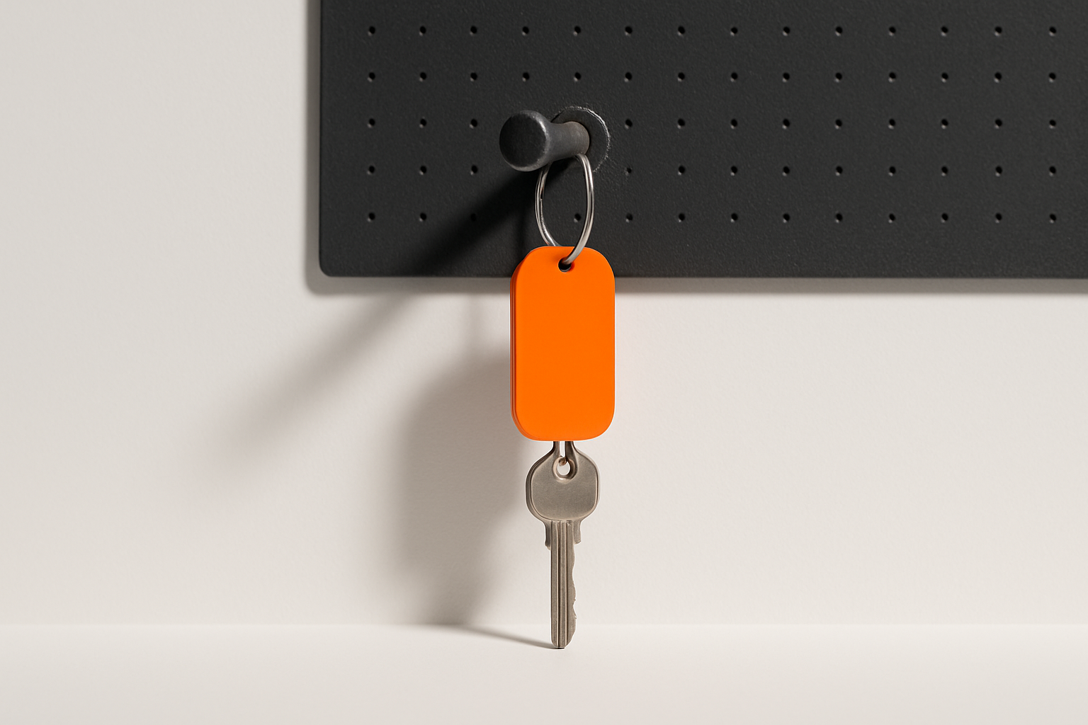 Dusty unused key on a pegboard hook with an orange tag, symbolizing an ai reversal left idle
