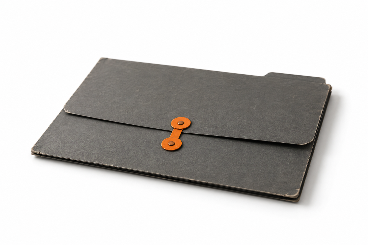 Worn charcoal card folder closed with an orange button-and-string clasp, lying flat on a white background
