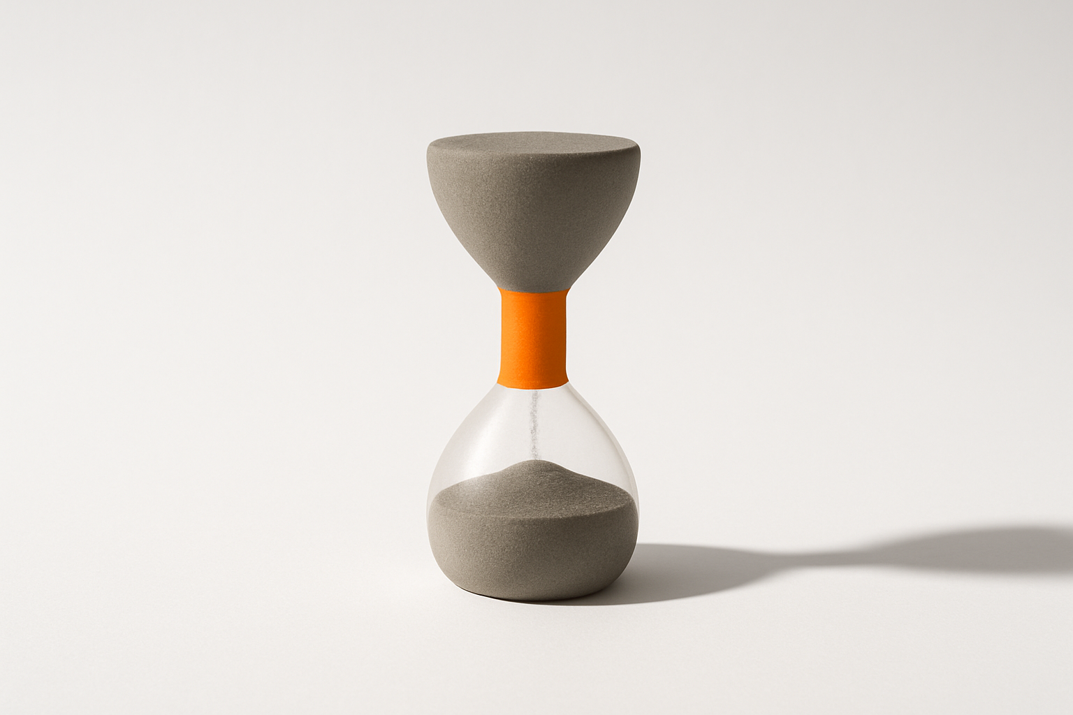 Hourglass with grey sand and a solid orange neck, showing why ai is not saving my team time